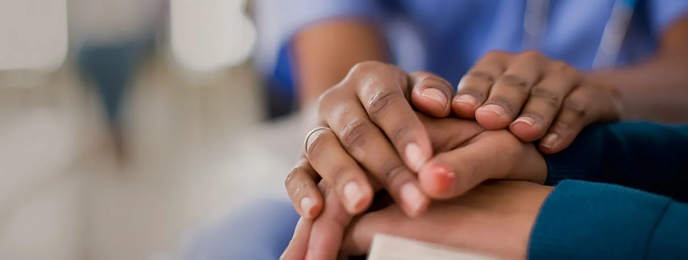 a close-up of hands shaking