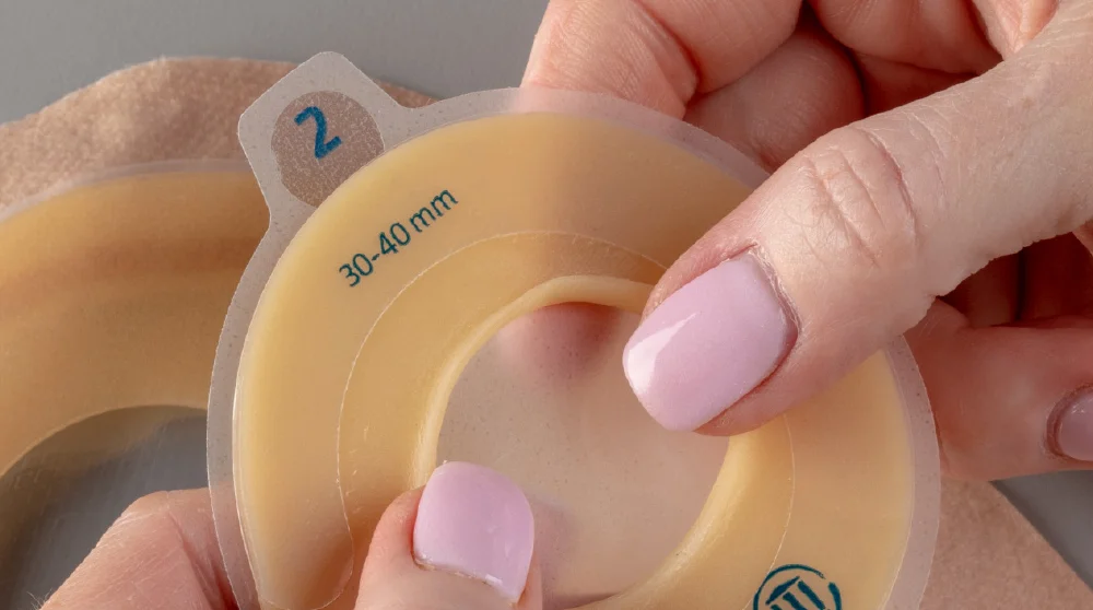 a person holding a yellow bottle