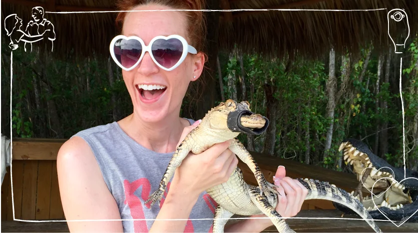 a woman holding a snake