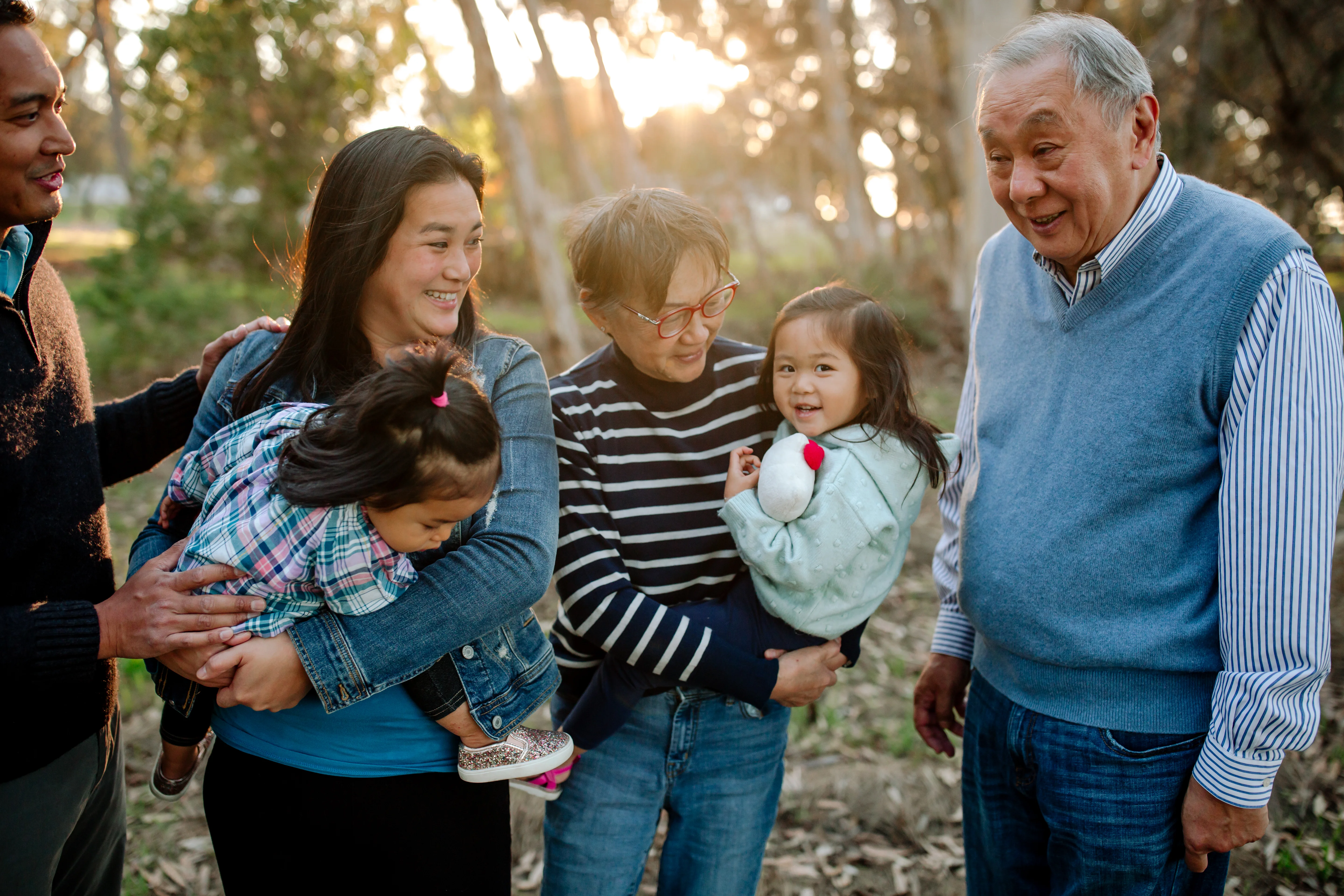 a group of people holding a child